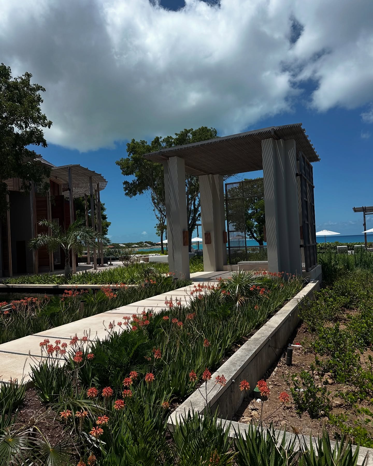 Garden pathway leading to the oceanfront retreat pavilion