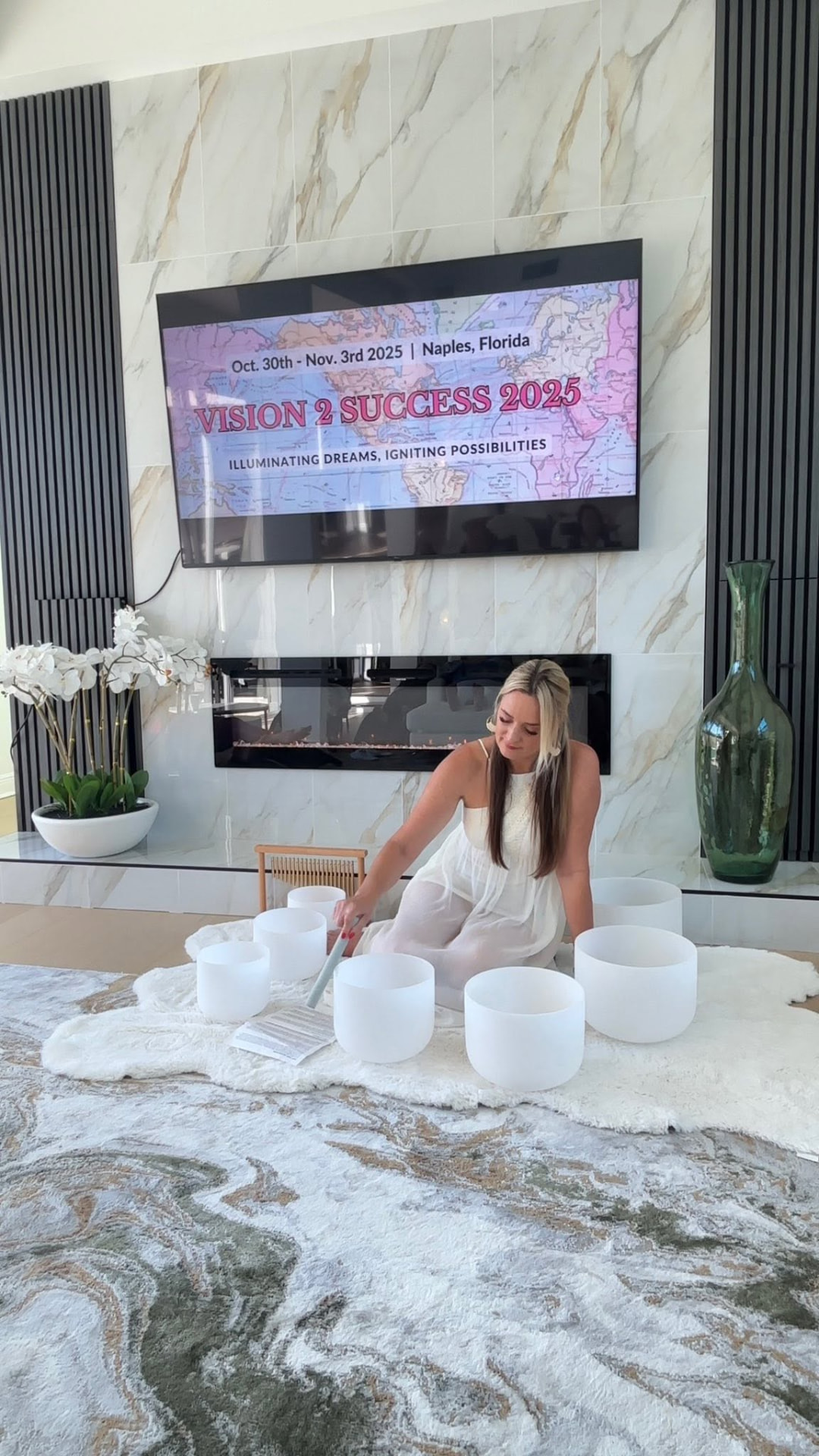 Michelle preparing a circle of crystal singing bowls before a retreat sound bath